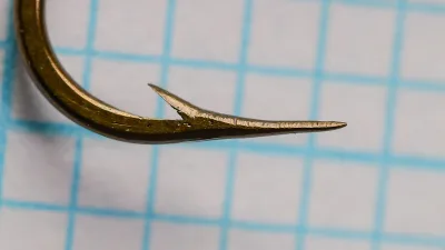 Mustad-Viking Hooks No. 4 — profile view showing hook point detail, bent geometry, and kirbed offset — size 4 — bronzed finish on measurement grid
