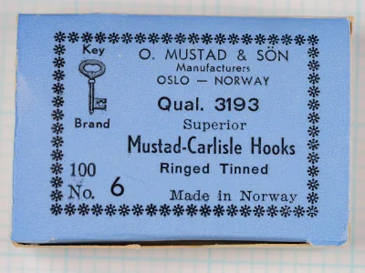 Mustad Quality 3193 Carlisle Hooks — manufacturer box exterior, powder-blue with black letterpress print and star border — size 6, 100-count tinned — front lid view