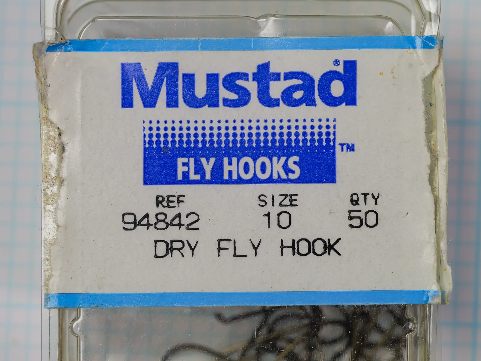 Mustad 94842 size 10 package, a plastic blister on a printed card reading REF 94842, SIZE 10, QTY 50.