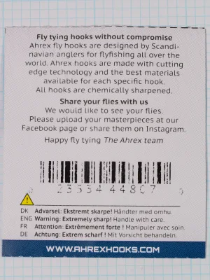 Back of the Ahrex FW503 packet showing maker text, a barcode with digits, a warning in four languages and the AHREX web address on a blue band.