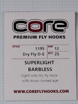 Front of a white card with the black and maroon Core wordmark, PREMIUM FLY HOOKS, and a ruled box listing style 1195 Dry Fly D-E, size 12 and quantity 25.