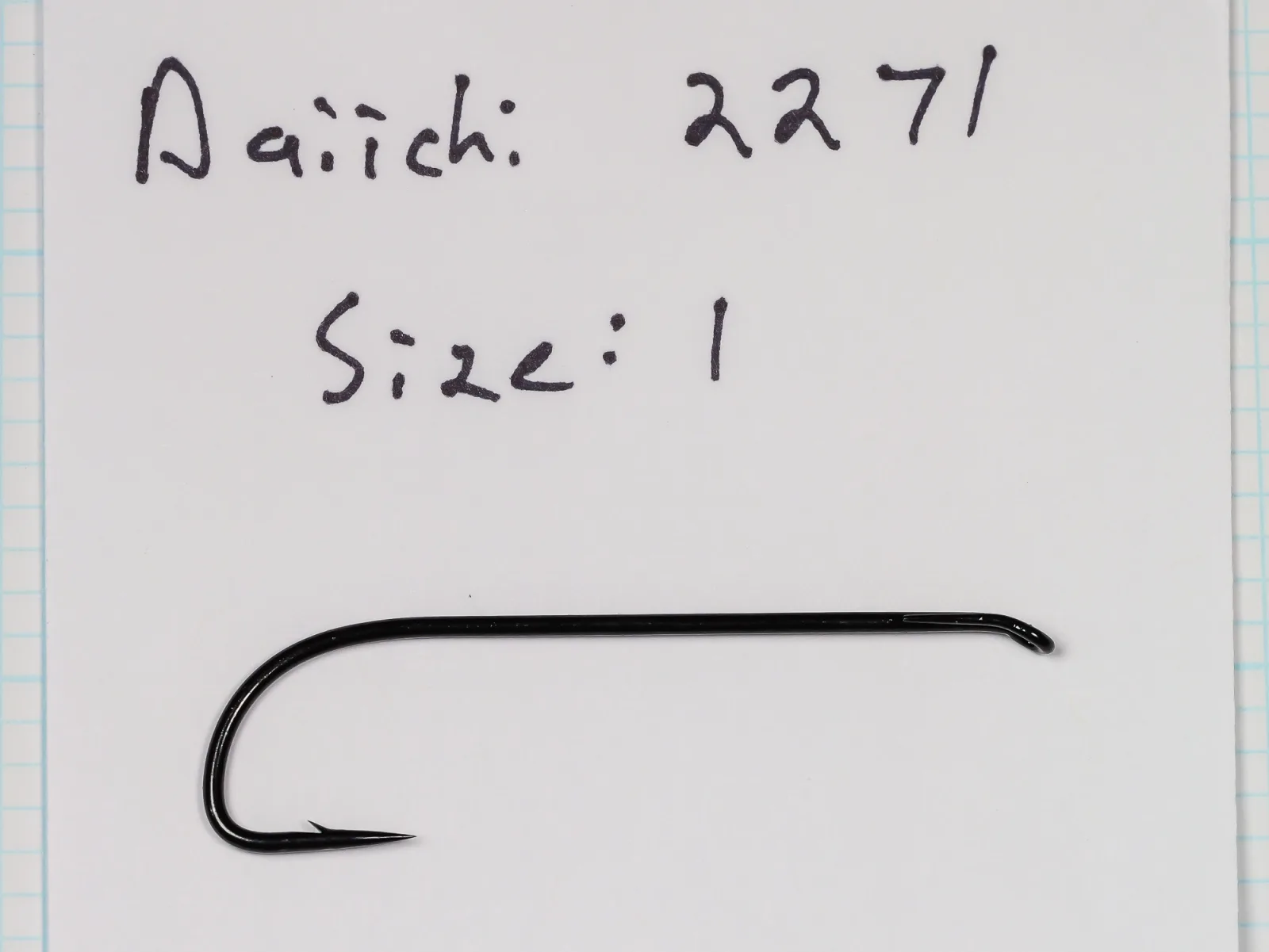 Black hook lying on a white card handwritten Daiichi 2271, Size: 1.
