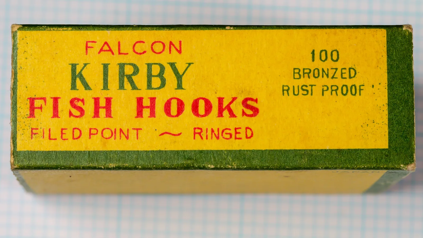 Side panel of the box printed FALCON KIRBY FISH HOOKS and FILED POINT ~ RINGED on the left, and 100 BRONZED RUST PROOF on the right.
