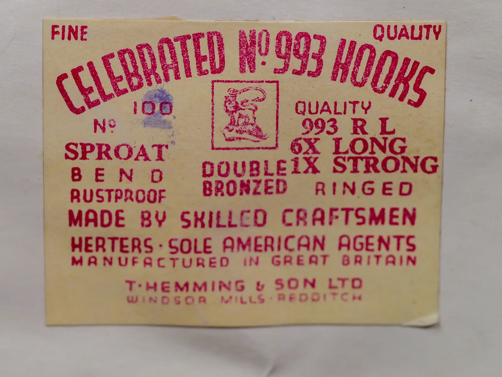 Cream paper label printed in red ink, with an arched Celebrated No. 993 Hooks heading, a boxed device at center, model and bend blocks, and a violet numeral at left.
